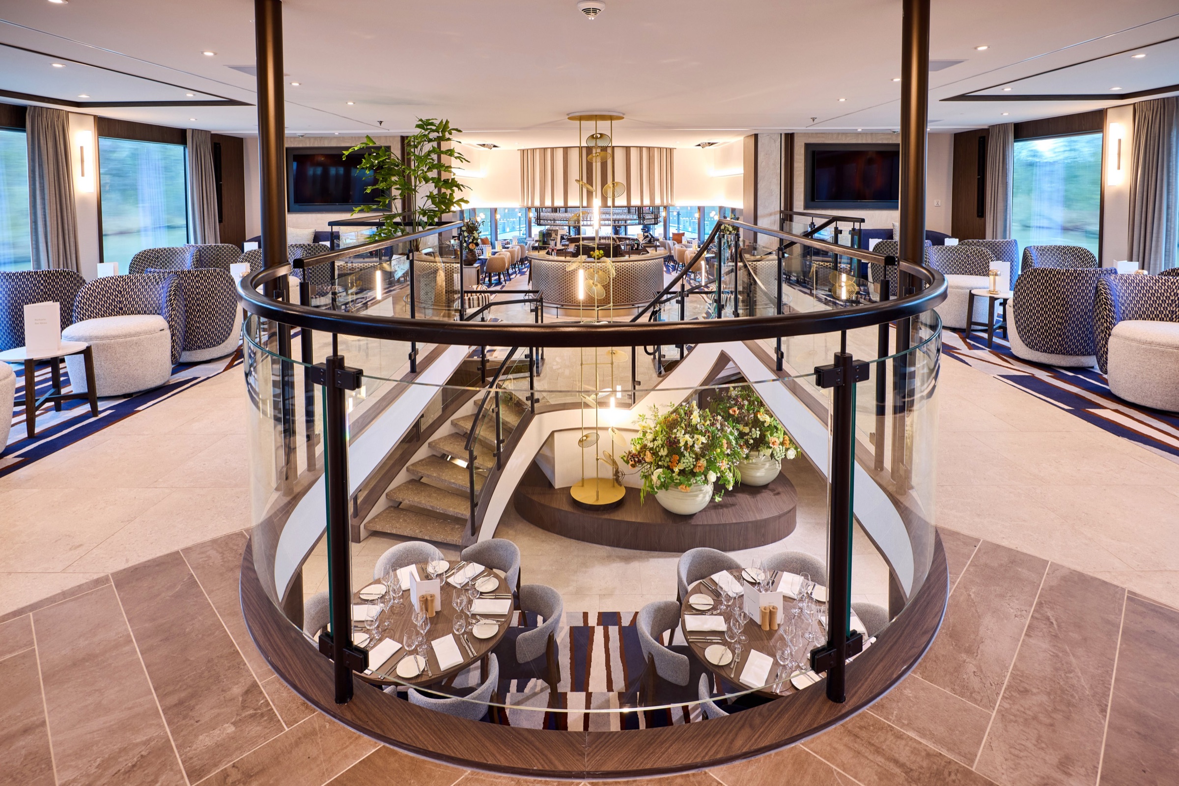 The light-filled lounge and dining space aboard VIVA ENJOY